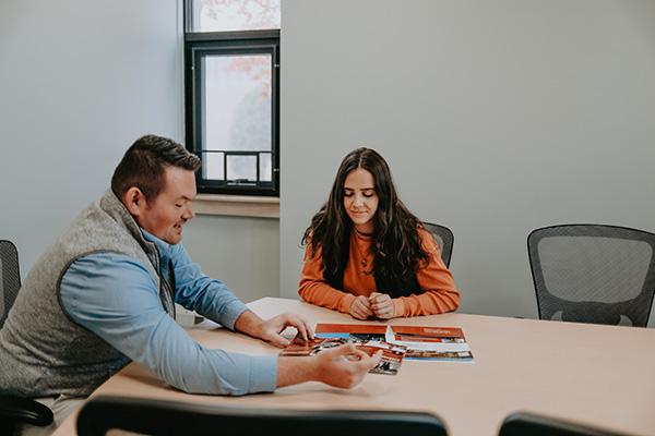 Student meeting with a Thomas Admissions counselor